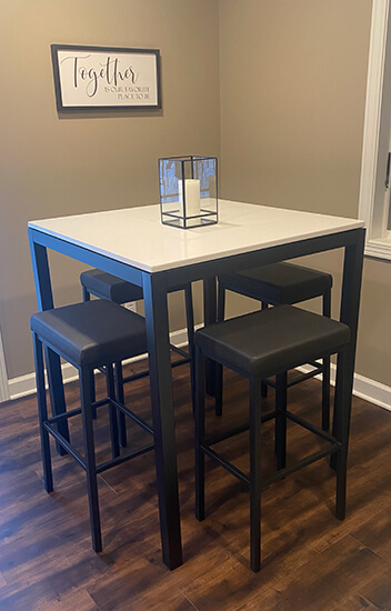 Amisco's Bradley Backless Bar Stools in Black with Pub Table
